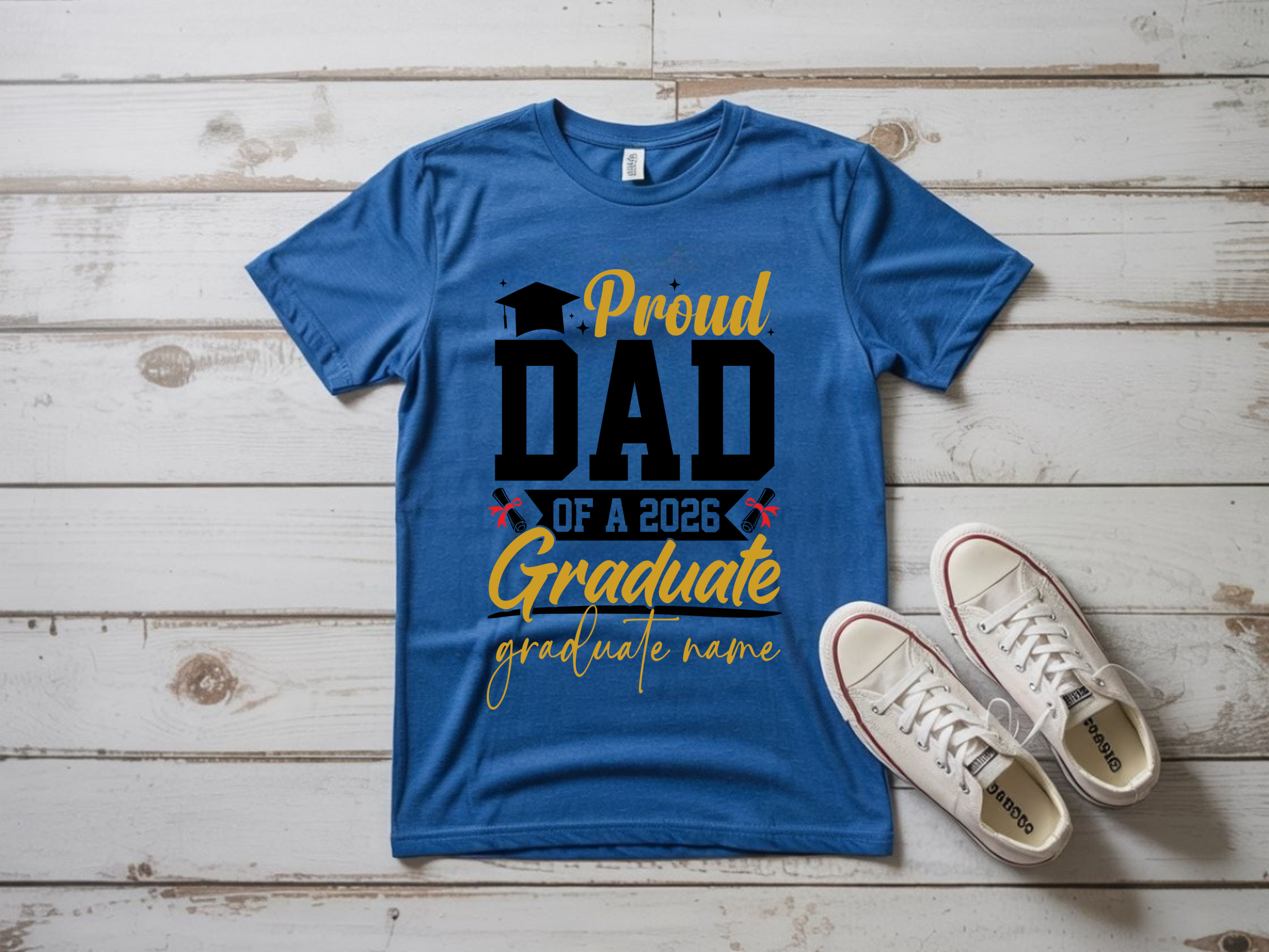 Blue “Proud Dad of a 2026 Graduate” personalized t-shirt with graduation cap and diploma graphics displayed flat lay with sneakers — custom graduation shirt for proud fathers and Class of 2026 celebrations.