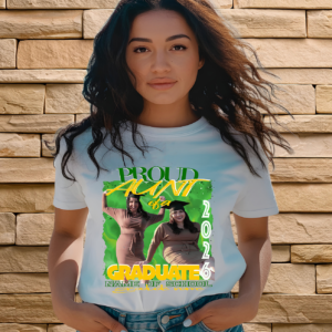 Woman wearing a white "Proud Aunt of a 2026 Graduate" T-shirt with a custom green and yellow design featuring two celebratory photos and text space for school name.