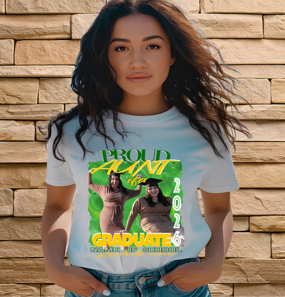 Woman wearing a white "Proud Aunt of a 2026 Graduate" T-shirt with a custom green and yellow design featuring two celebratory photos and text space for school name.