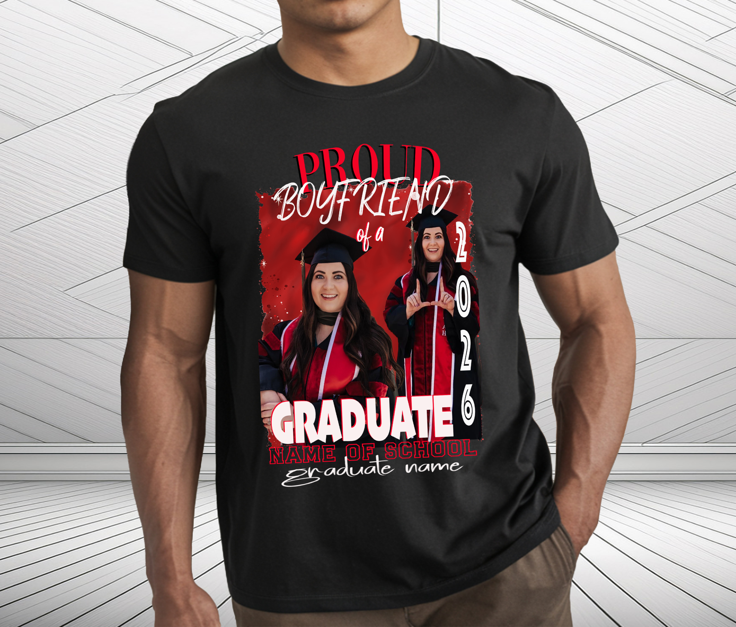 Man wearing black colored custom proud boyfriend of a 2026 graduate with red and black theme. Shirt is personalized with the relation of the graduate, the graduates pictures, name and name of school.