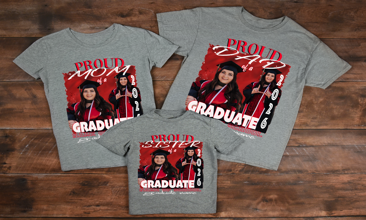 Three gray T-shirts displayed on a wooden surface, each featuring a red and white “Proud Mom of a 2026 Graduate,” “Proud Dad of a 2026 Graduate,” and “Proud Sister of a 2026 Graduate” design with customizable photo, school name, and graduate name.