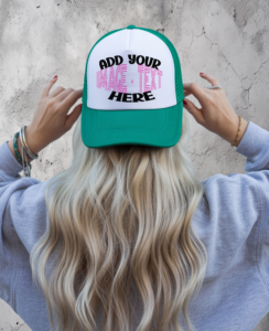 Person wearing a green and white trucker hat with a customizable front panel displaying the text “Add Your Image or Text Here.”