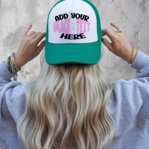 Person wearing a green and white trucker hat with a customizable front panel displaying the text “Add Your Image or Text Here.”