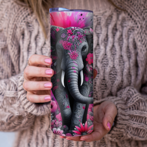 A skinny tumbler with a detailed floral elephant design in pink and gray tones, held in someone’s hands, choose to add text and placement of text.