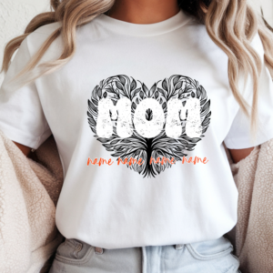 White women's custom t-shirt featuring a black heart-shaped tree of life design with distressed "Mom" lettering and four personalized children's names written in orange script below, worn by a woman with a cozy neutral aesthetic background.
