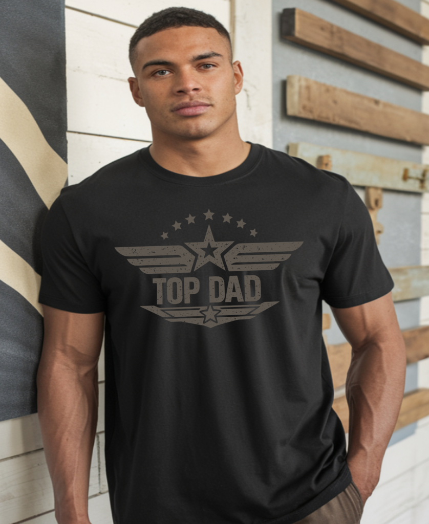 Black custom t-shirt with a military-style "Top Dad" graphic featuring wings, stars, and distressed lettering worn by a man