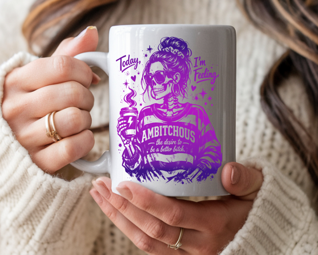 White ceramic coffee mug featuring a purple gradient skull woman in sunglasses holding a coffee cup, with the text "Today I'm Feeling Ambitchous – the desire to be a better bitch"