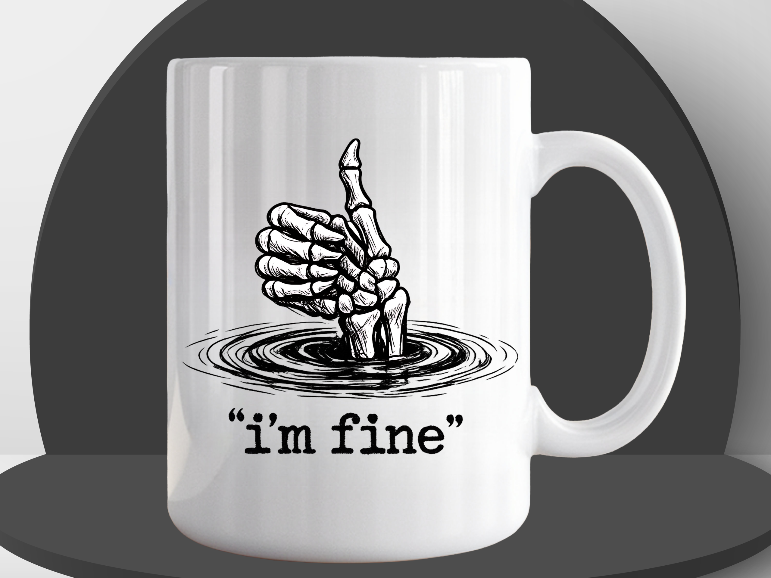 White ceramic coffee mug featuring a skeletal hand giving a thumbs up while sinking into water, with the text "i'm fine" in quotation marks on a black podium